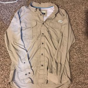 Tan fishing shirt.